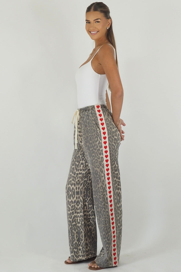 Women's leopard print wide leg jeans with white stripe and red hearts