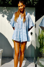 Women's blue cotton playsuit with white abstract sun print