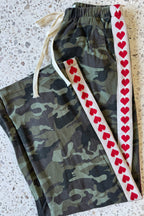 Women's green camouflage wide leg jeans with white stripe and red hearts