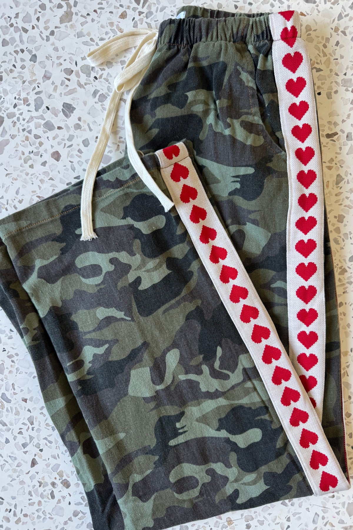 Women's green camouflage wide leg jeans with white stripe and red hearts