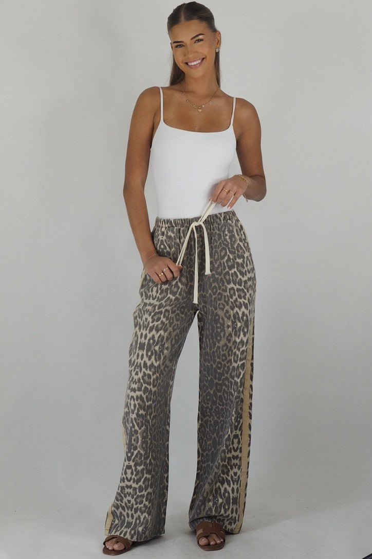 Women's leopard print wide leg jeans with beige racer stripes