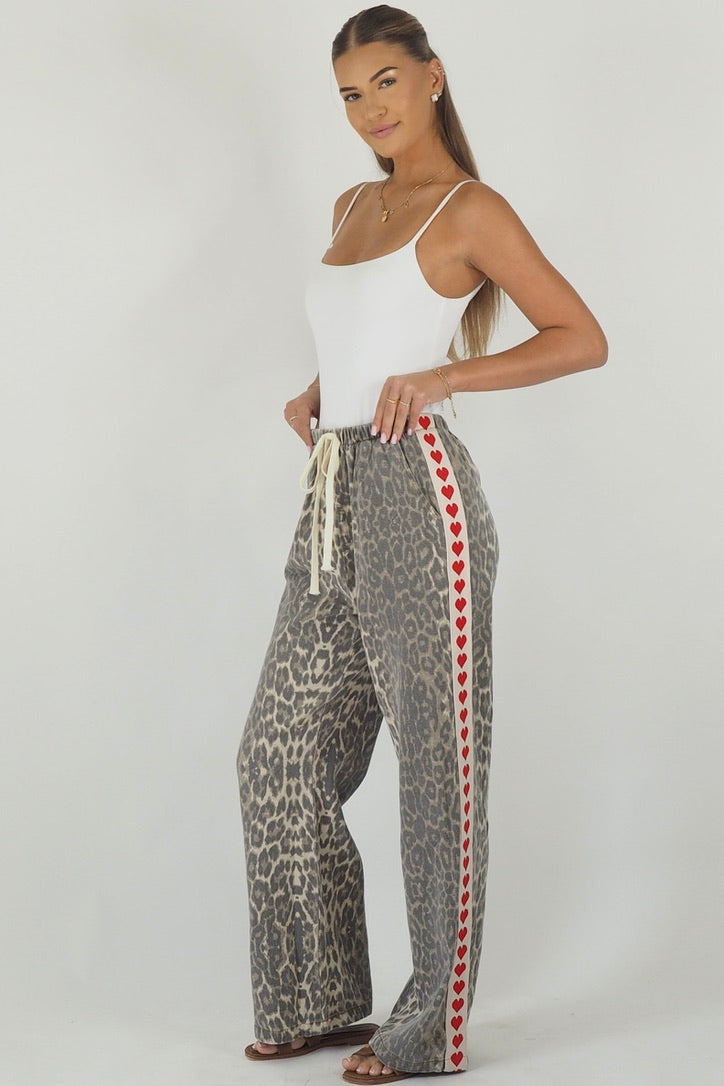 Women's leopard print wide leg jeans with white stripe and red hearts