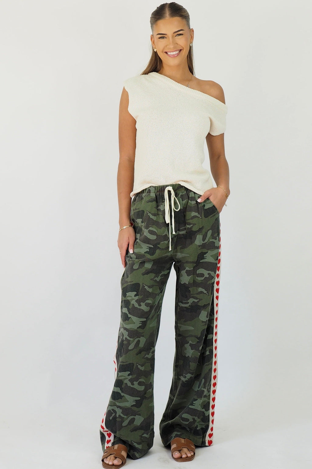 Women's green camouflage wide leg jeans with white stripe and red hearts