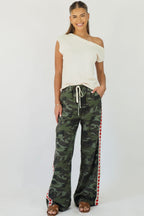 Women's green camouflage wide leg jeans with white stripe and red hearts