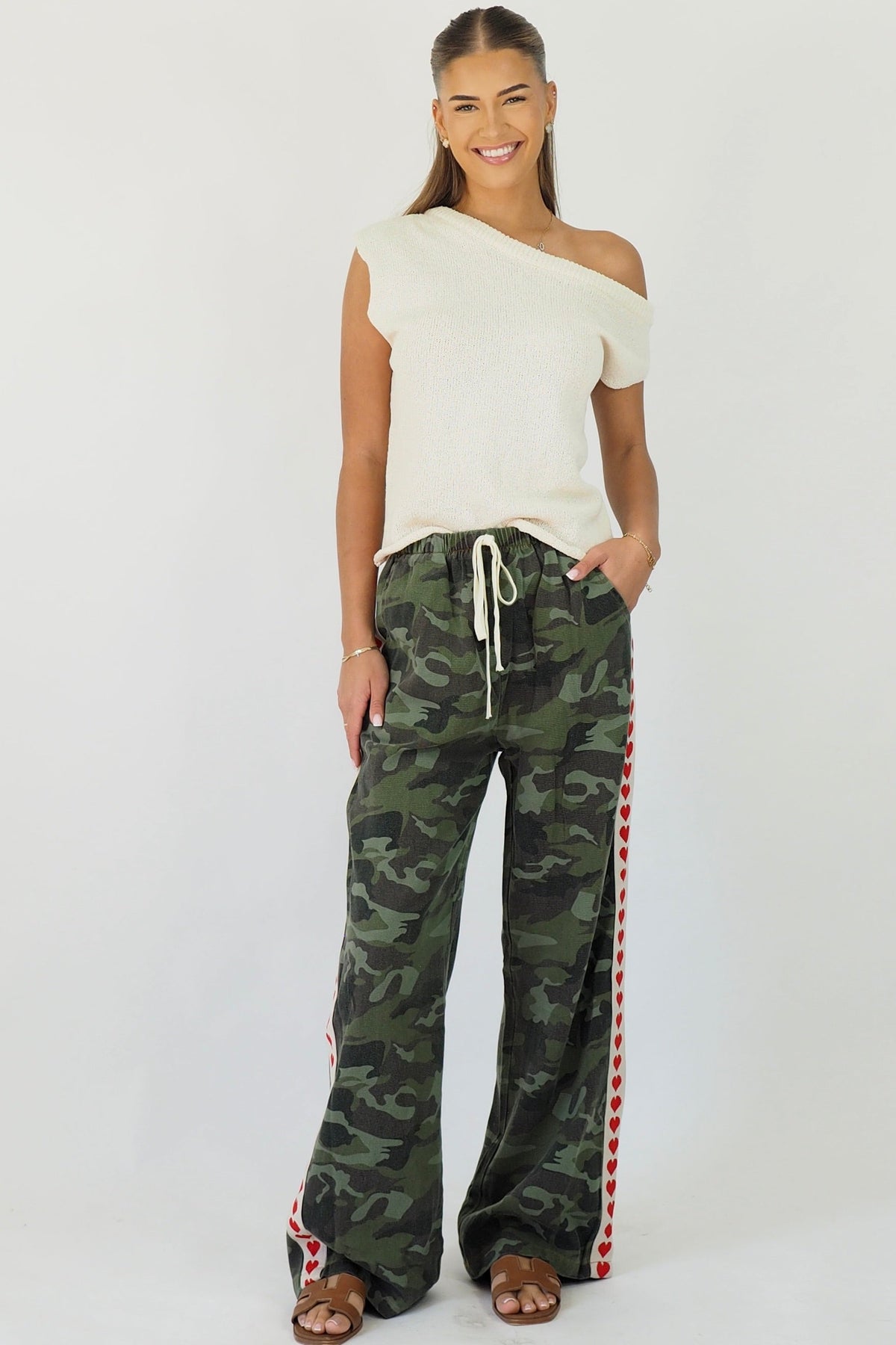 Women's green camouflage wide leg jeans with white stripe and red hearts