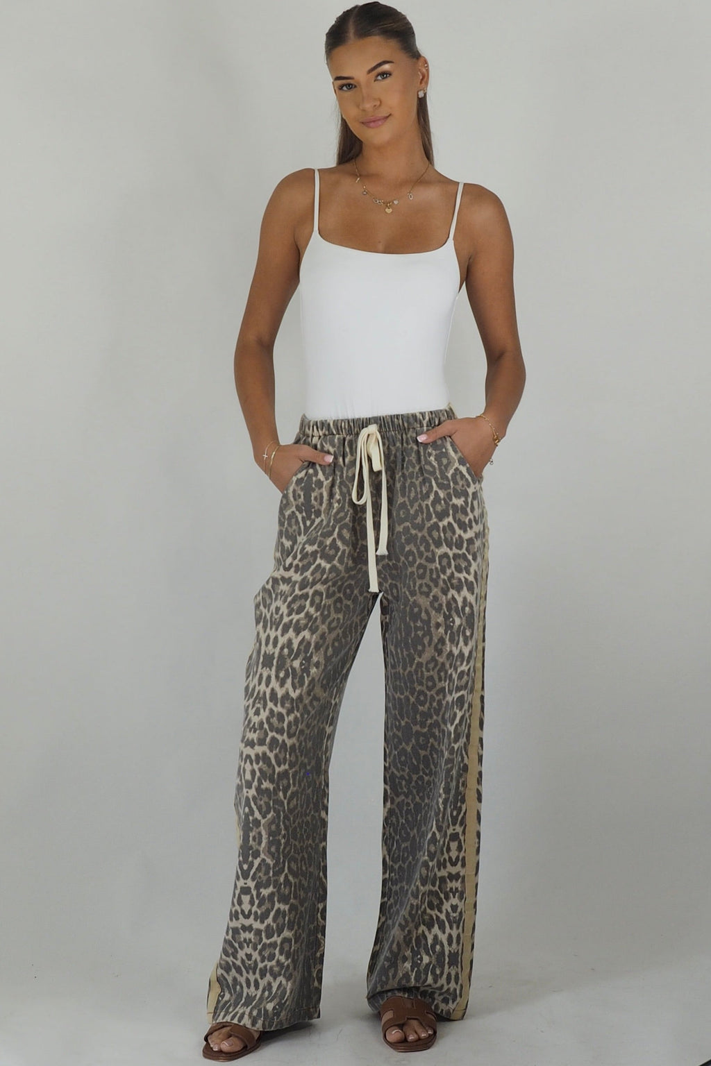 Women's leopard print wide leg jeans with beige racer stripes