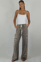 Women's leopard print wide leg jeans with beige racer stripes