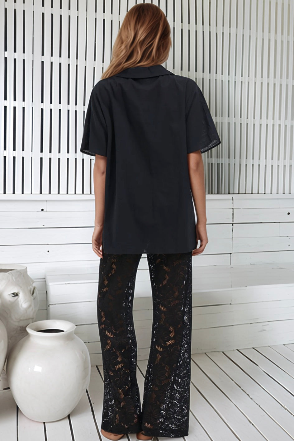 Women's black two piece set with collared shirt and sheer lace trousers