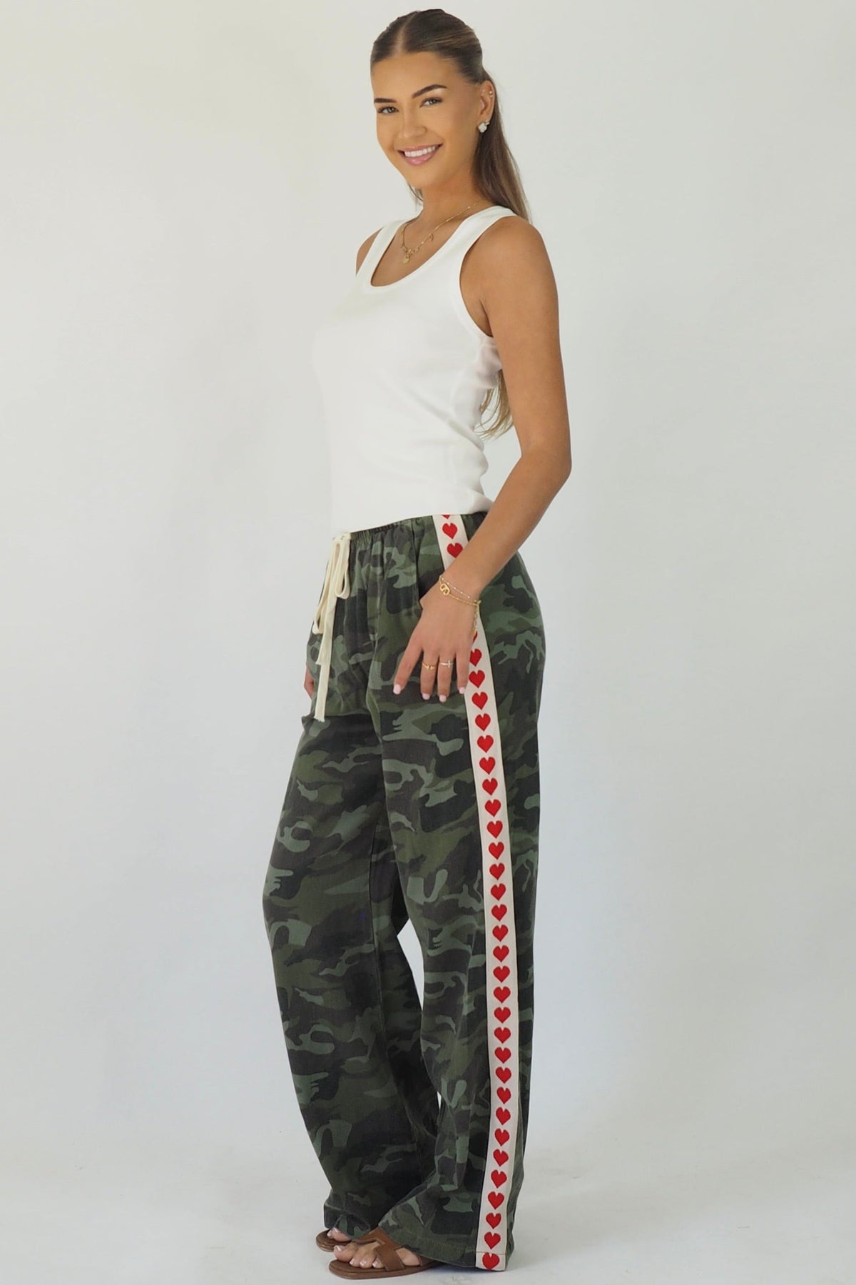 Women's green camouflage wide leg jeans with white stripe and red hearts