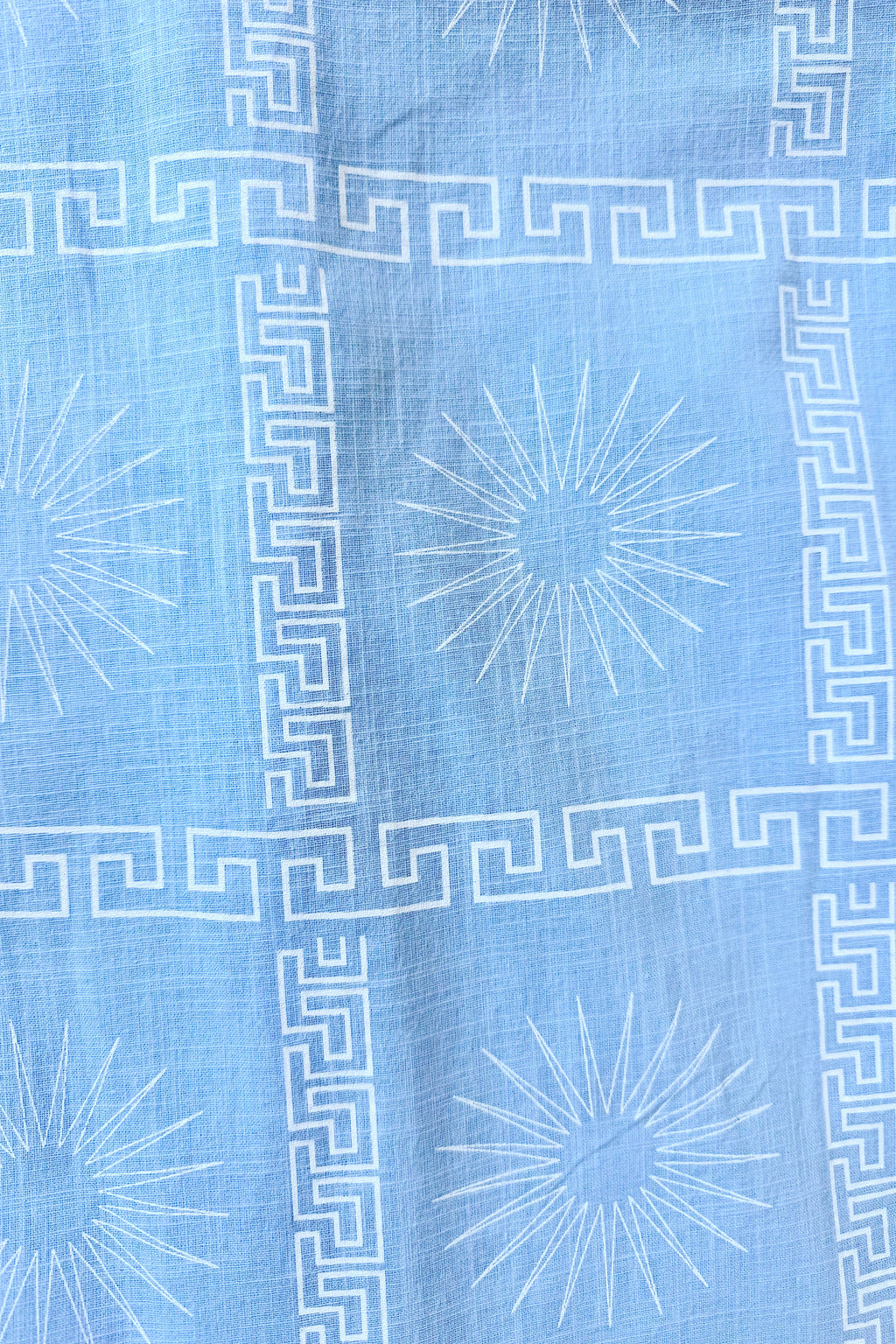 Women's blue cotton playsuit with white abstract sun print
