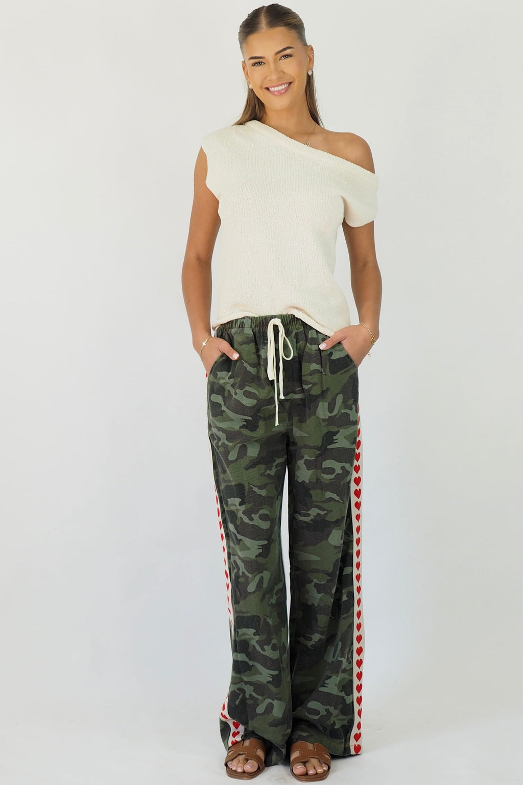 Women's green camouflage wide leg jeans with white stripe and red hearts