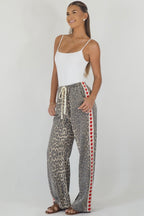 Women's leopard print wide leg jeans with white stripe and red hearts