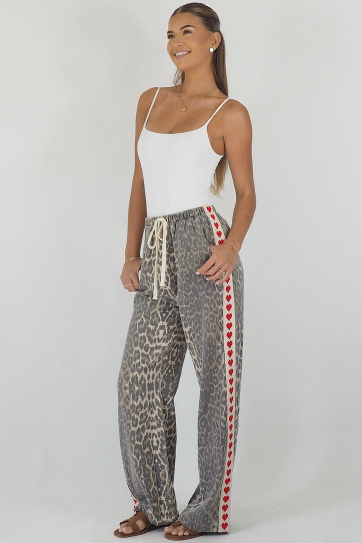 Women's leopard print wide leg jeans with white stripe and red hearts