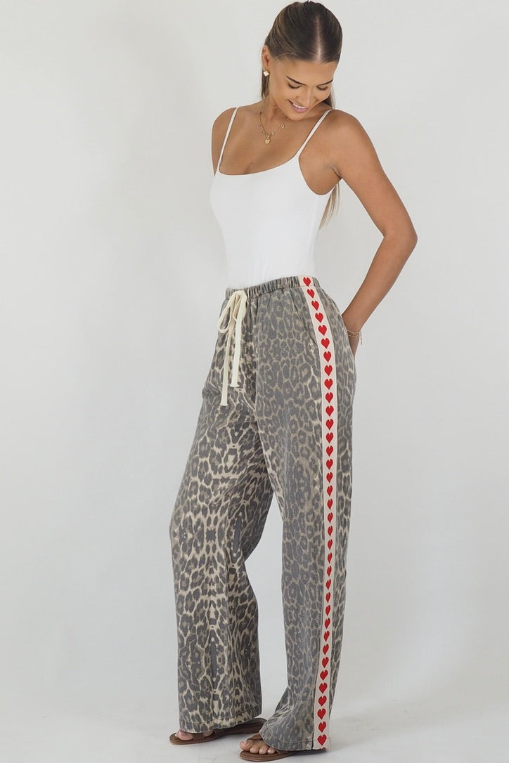 Women's leopard print wide leg jeans with white stripe and red hearts