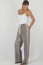 Women's leopard print wide leg jeans with white stripe and red hearts