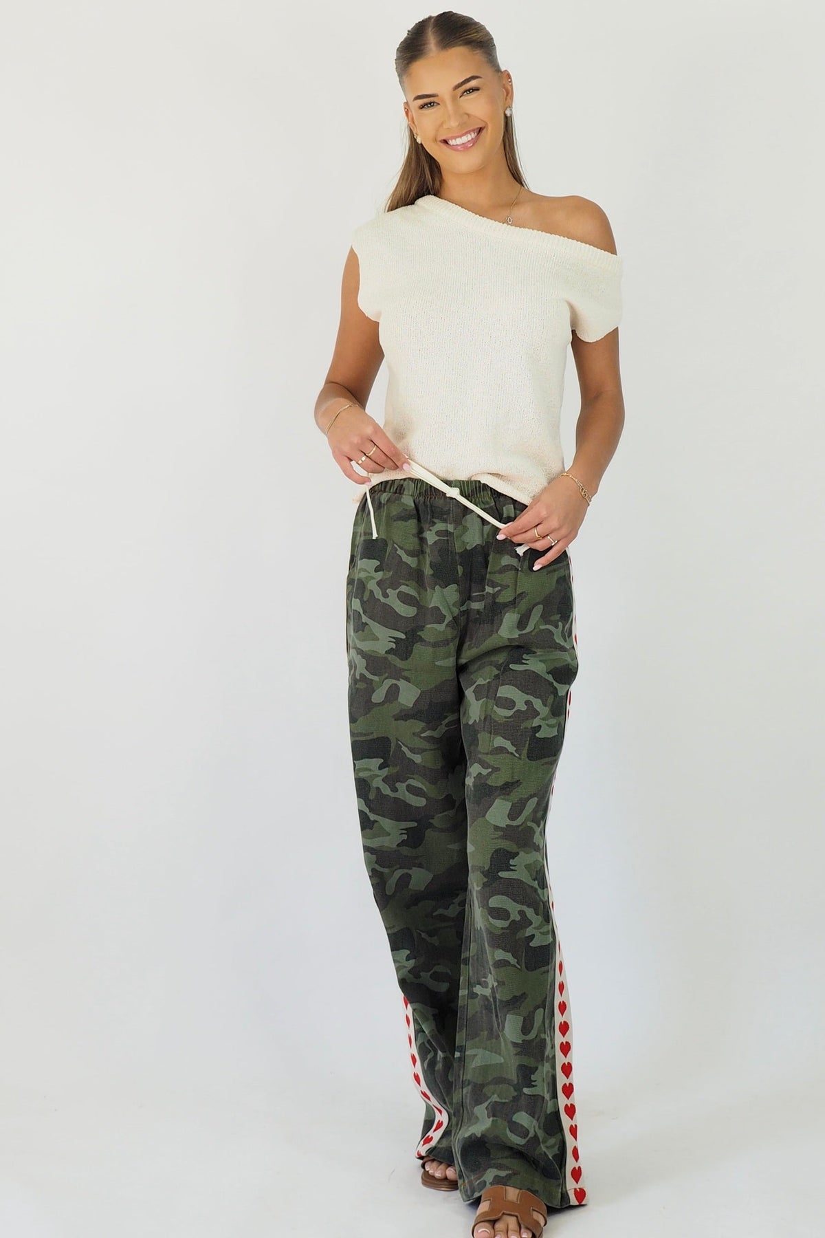 Women's green camouflage wide leg jeans with white stripe and red hearts
