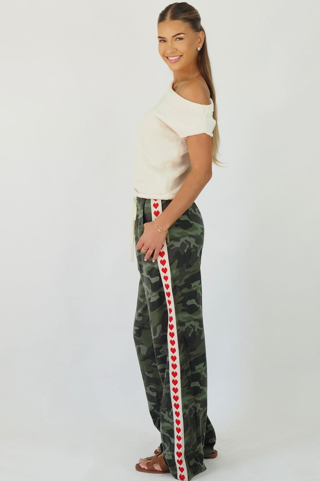 Women's green camouflage wide leg jeans with white stripe and red hearts
