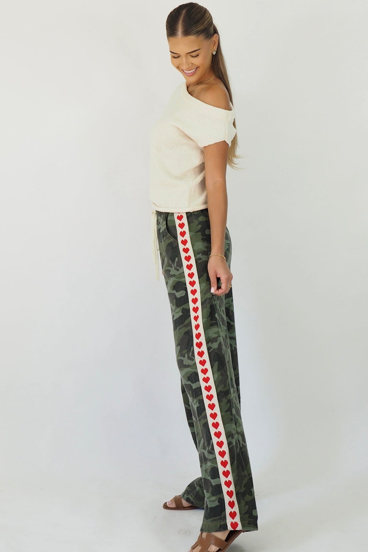 Women's green camouflage wide leg jeans with white stripe and red hearts