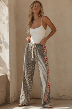 Women's leopard print wide leg jeans with white stripe and red hearts