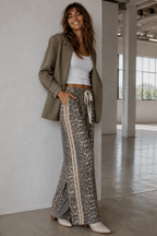 Women's leopard print wide leg jeans with beige racer stripes