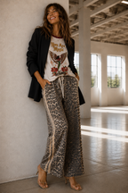 Women's leopard print wide leg jeans with beige racer stripes