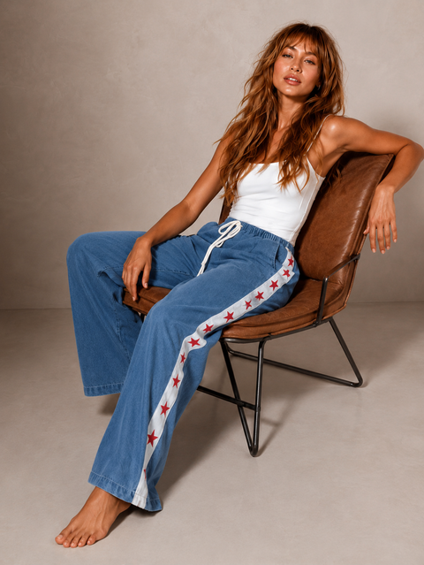 Women's denim wide leg jeans with white racer stripe and red stars