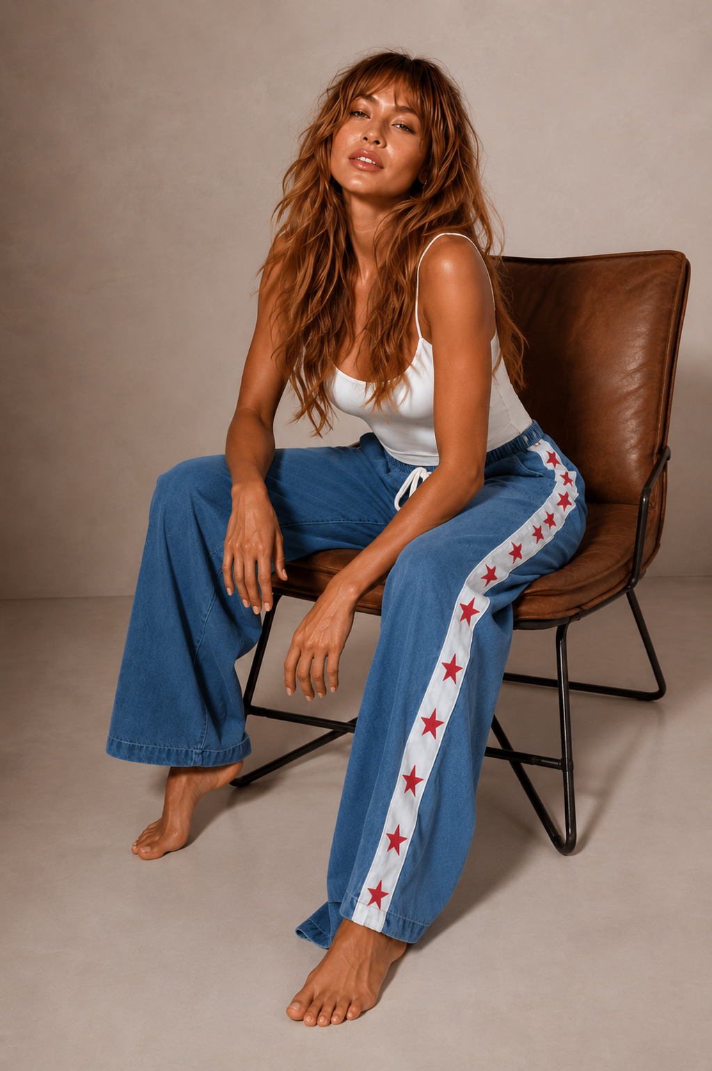 Women's denim wide leg jeans with white racer stripe and red stars