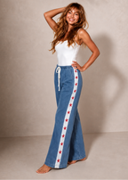 Women's denim wide leg jeans with white racer stripe and red stars