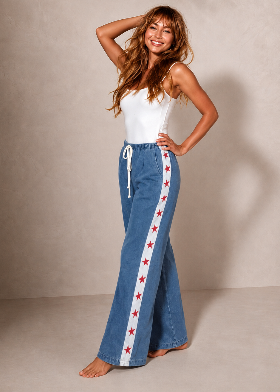 Women's denim wide leg jeans with white racer stripe and red stars