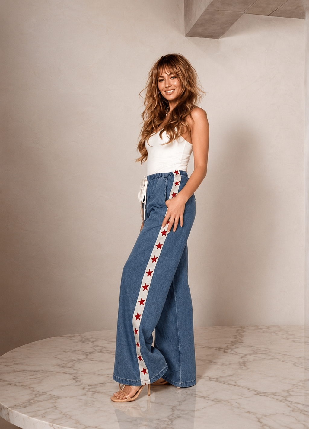 Women's denim wide leg jeans with white racer stripe and red stars
