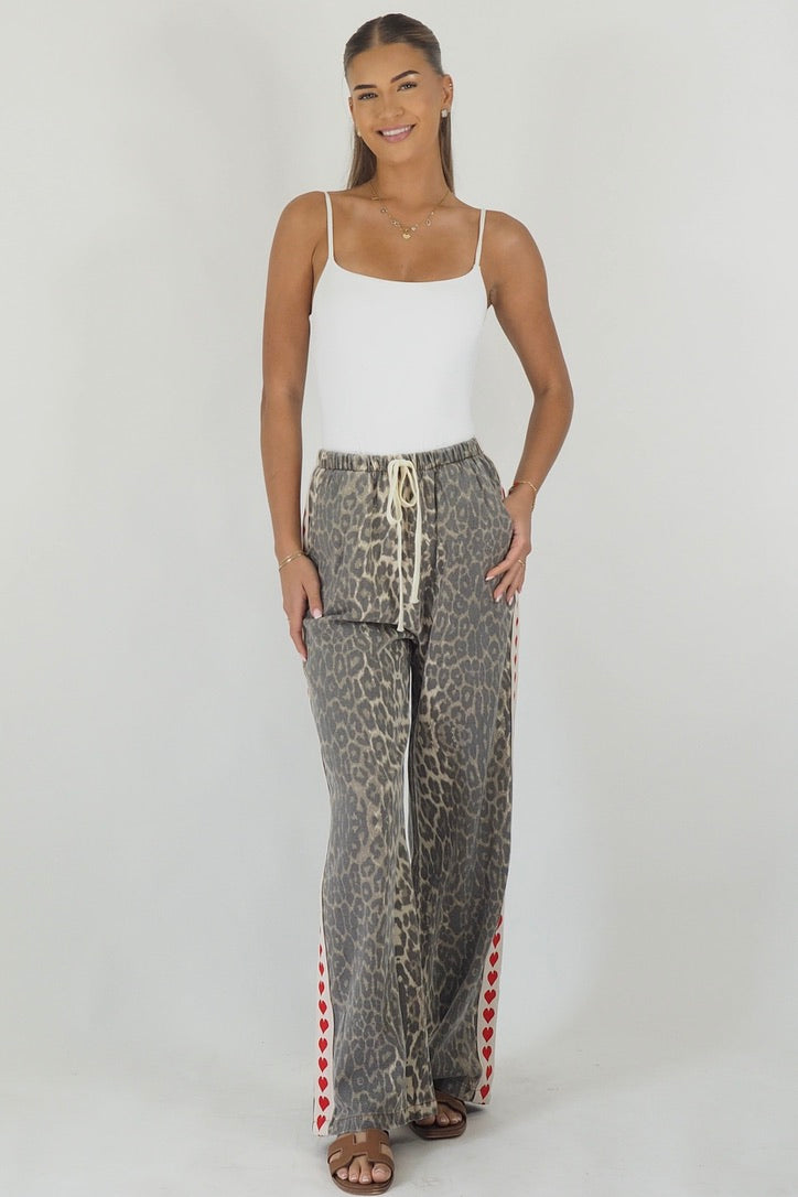 Women's leopard print wide leg jeans with white stripe and red hearts