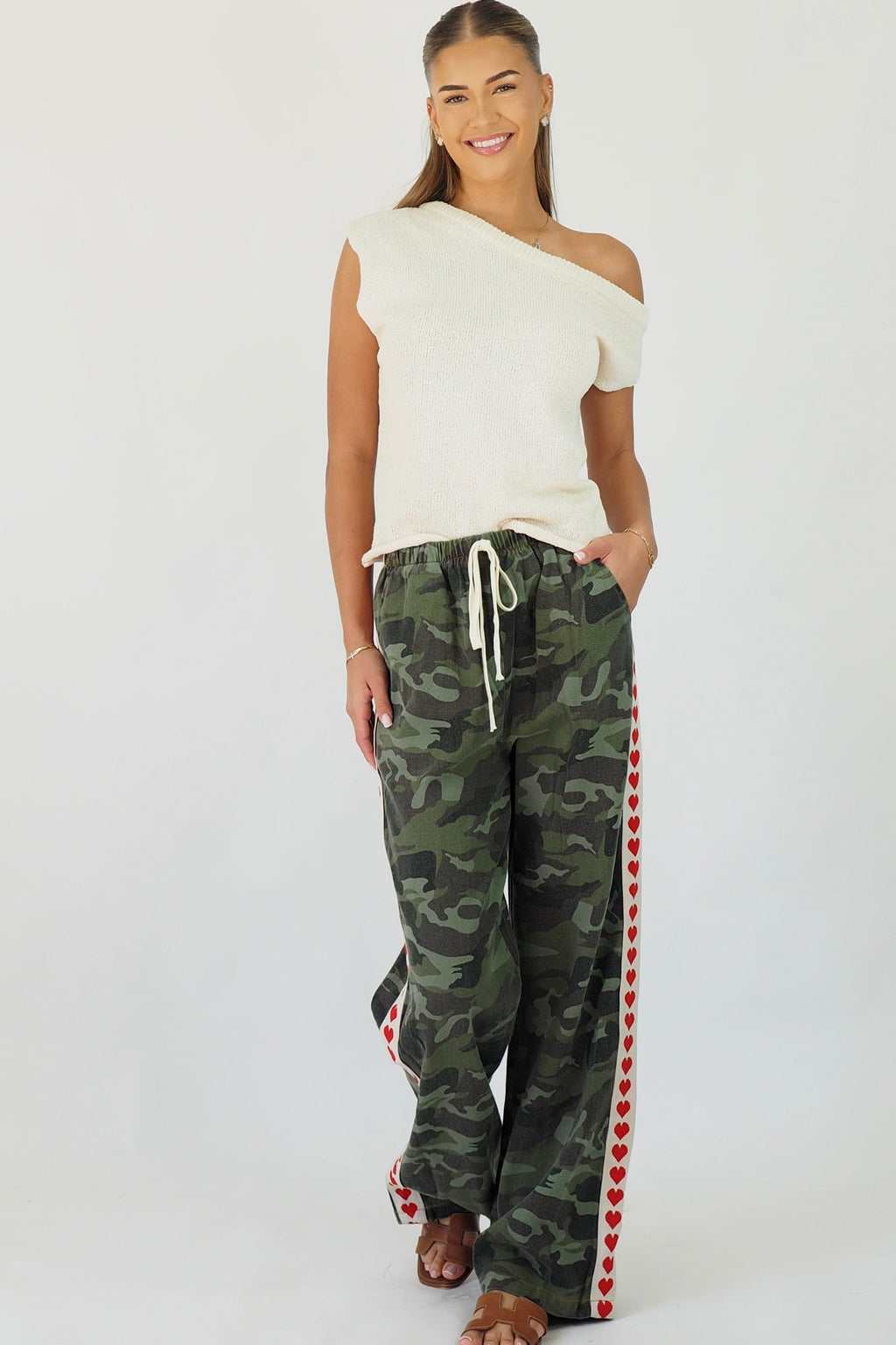 Women's green camouflage wide leg jeans with white stripe and red hearts