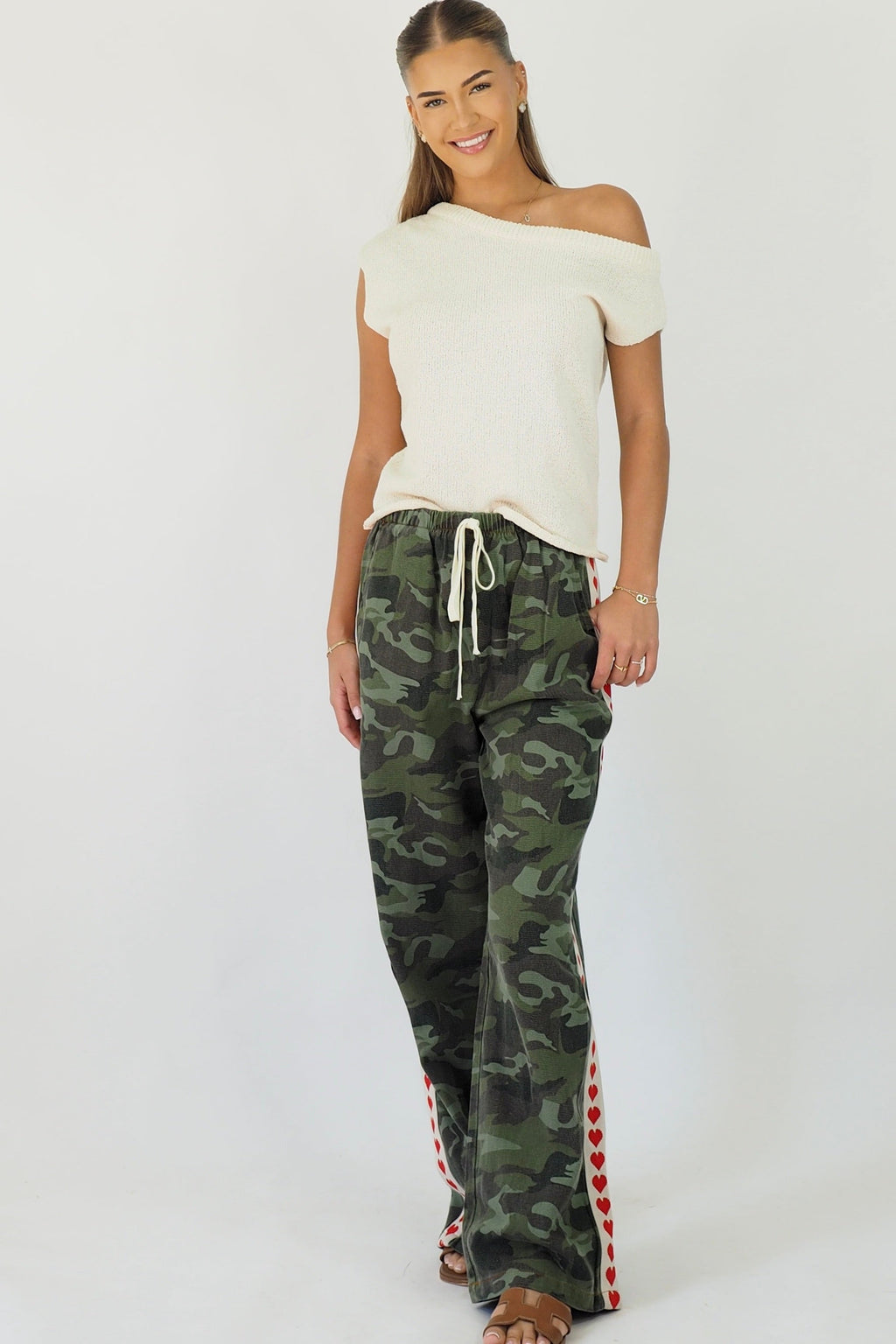 Women's green camouflage wide leg jeans with white stripe and red hearts