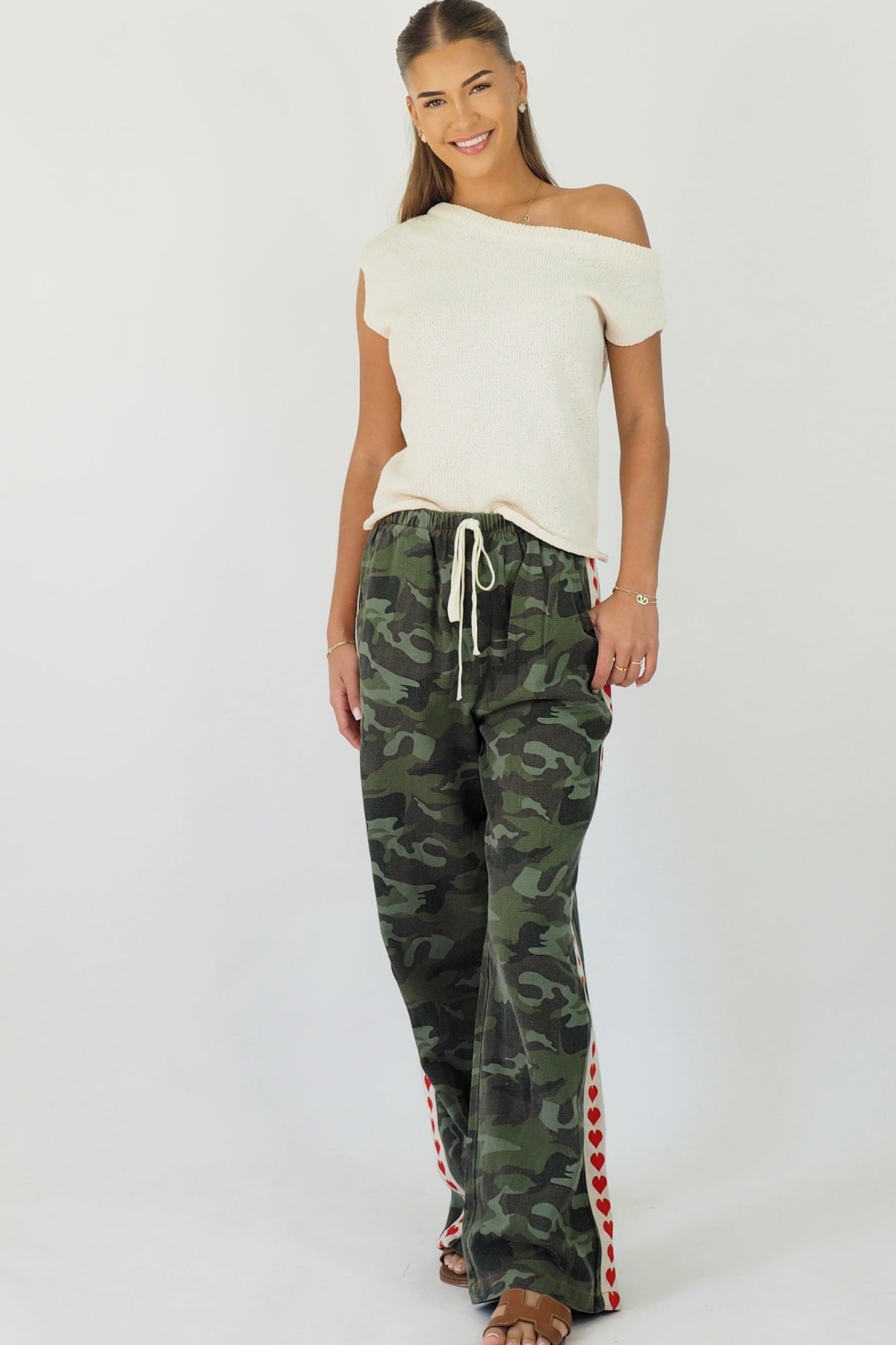 Women's green camouflage wide leg jeans with white stripe and red hearts