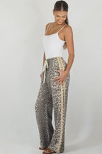 Women's leopard print wide leg jeans with beige racer stripes