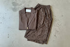 Women's brown two piece set with collared shirt and sheer lace trousers