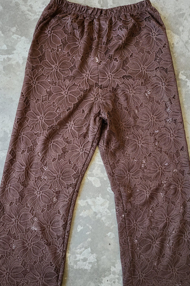 Women's brown two piece set with collared shirt and sheer lace trousers