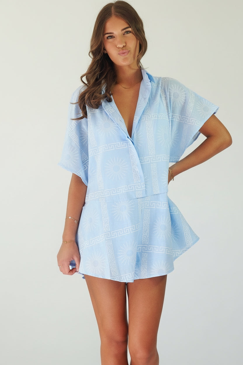Women's blue cotton playsuit with white abstract sun print
