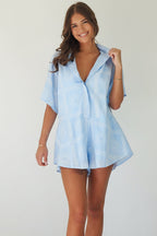 Women's blue cotton playsuit with white abstract sun print