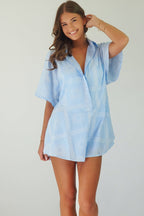 Women's blue cotton playsuit with white abstract sun print