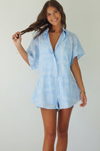 Women's blue cotton playsuit with white abstract sun print