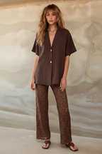 Women's brown two piece set with collared shirt and sheer lace trousers