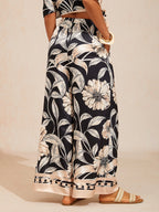 Golden Petal Satin Wide-Leg Pants in Golden Black by Aurelia Sun